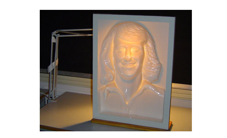 Grid comparing head rotation and smile reconstruction at different frequency settings.